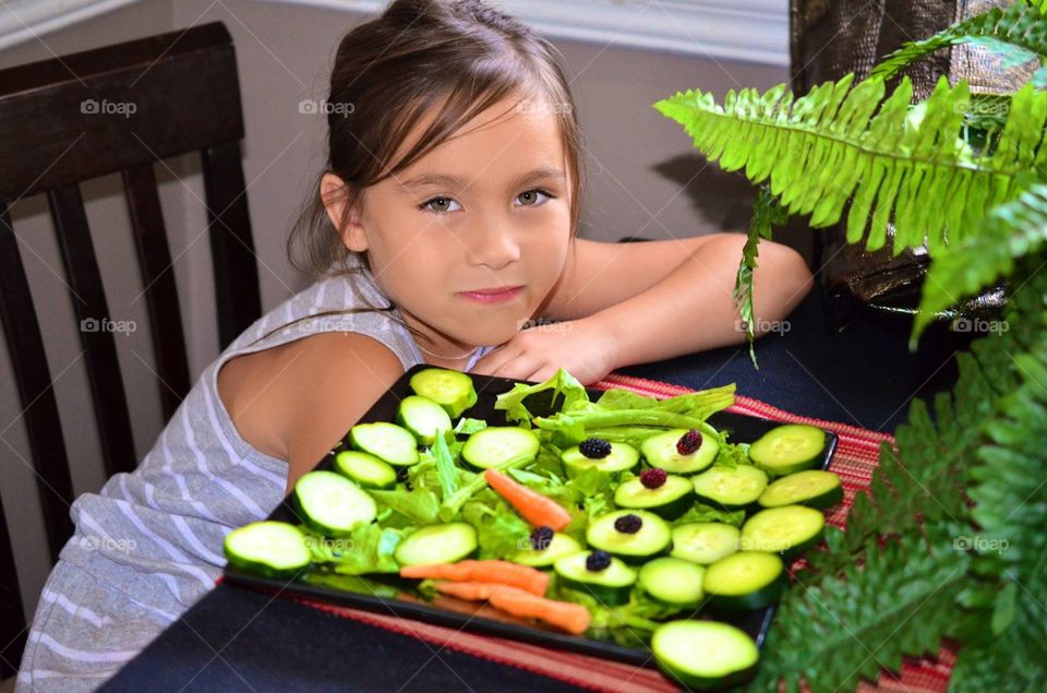 Home grown salad. Girl eating healthy salad