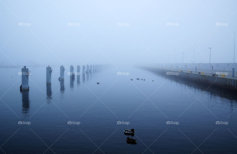 Water against foggy sky