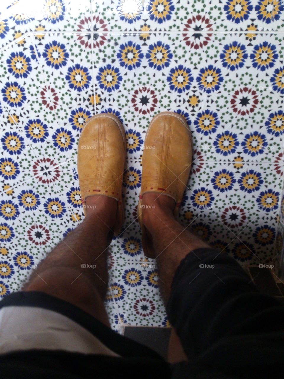 moroccan mosaic with a berber shoe that is called "RQQAB" That is handmade by artisans in the Moroccan southern.