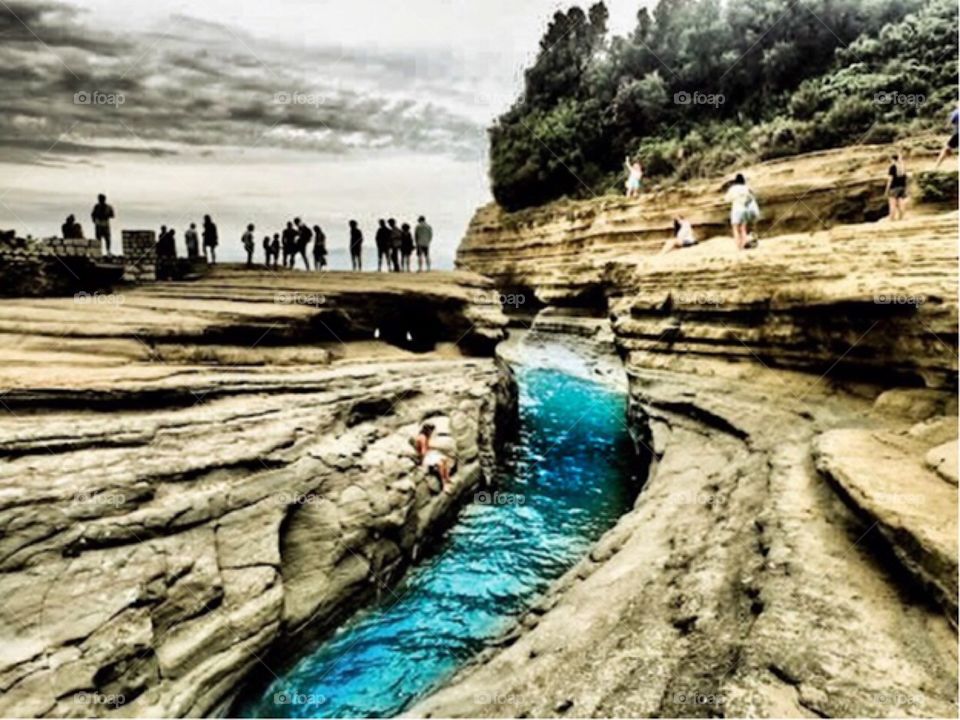 people on a mini canyion, ionian sea. 