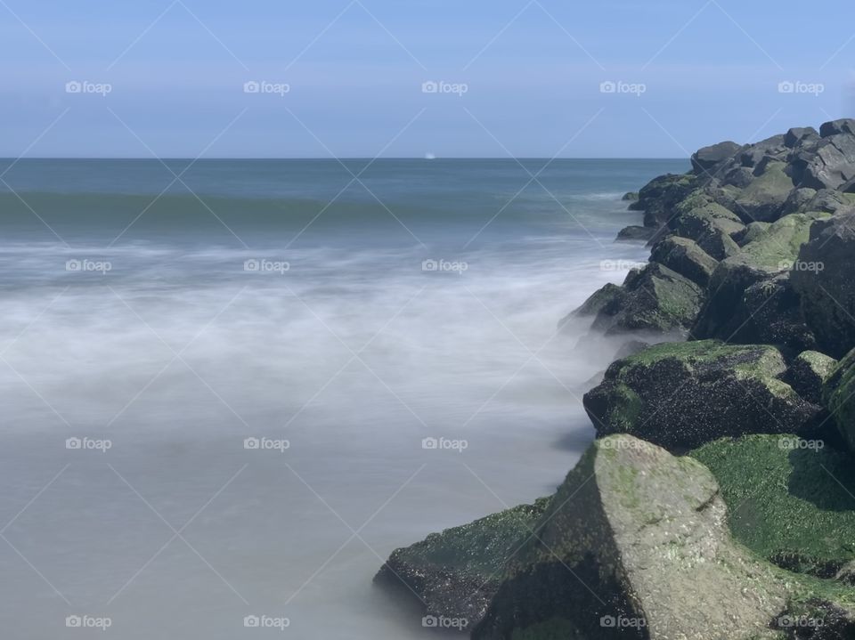 Misty ocean by the jetty