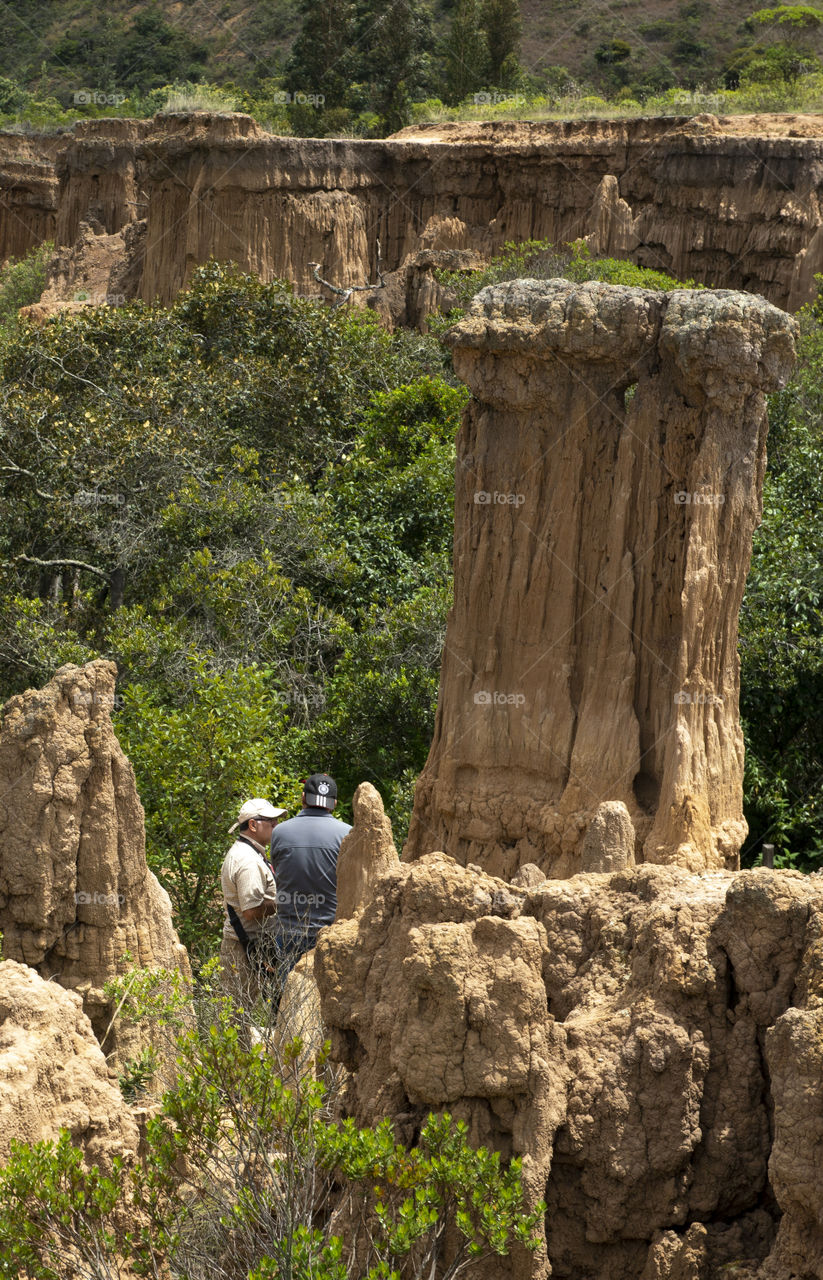 Men climbing a hill