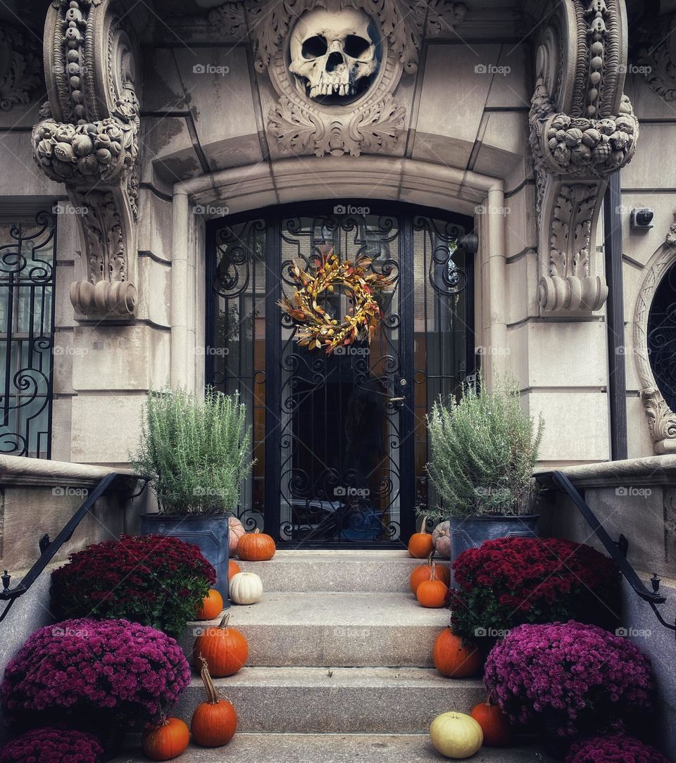 Halloween and autumn decorations at the entrance to a New York City townhouse 