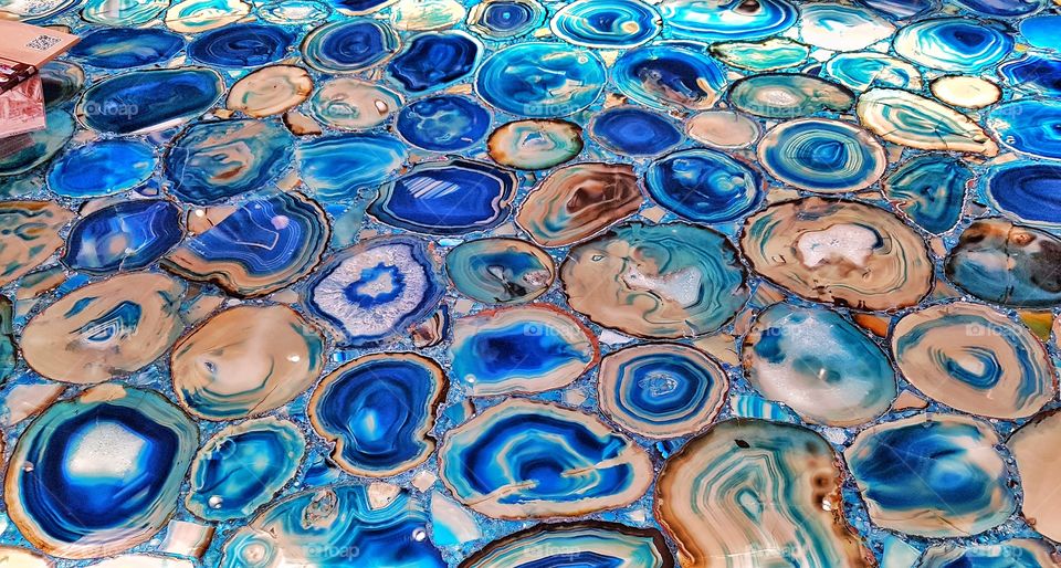 close up details of a table made of blue agath semi precious stone