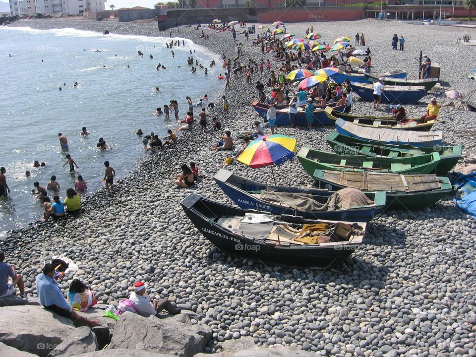 Frolicking at a Rocky Beach. Swimming, playing and family fun at the beach