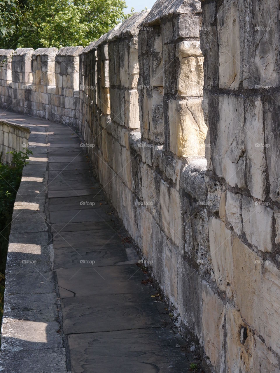 The historic fortified York Wall made of massive stone and a nice walkway surround the older parts of the city. 