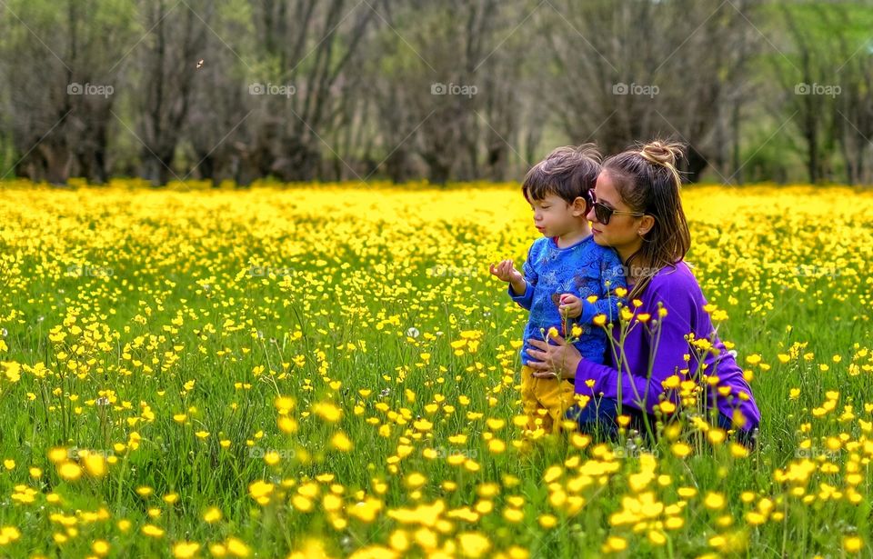 Mother and son in flowers
