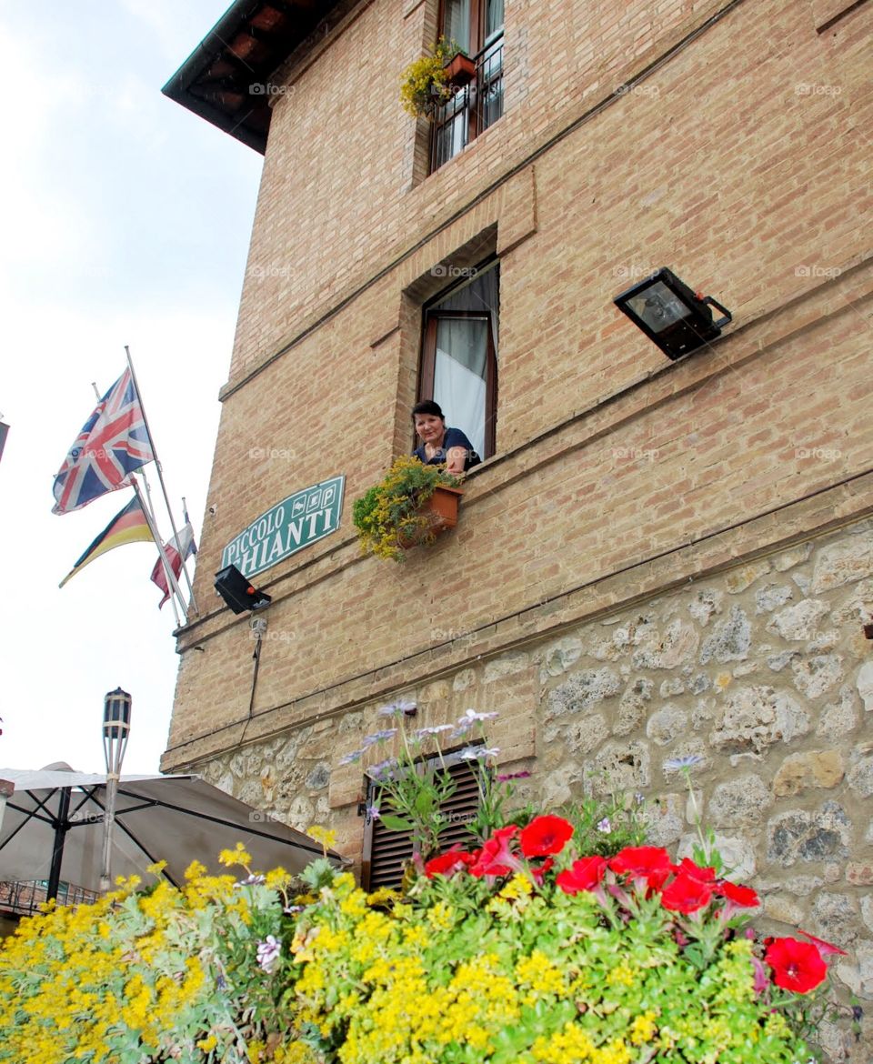 Sienna welcome . A smiling face welcomes visitors to a bed and breakfast in sienna Italy