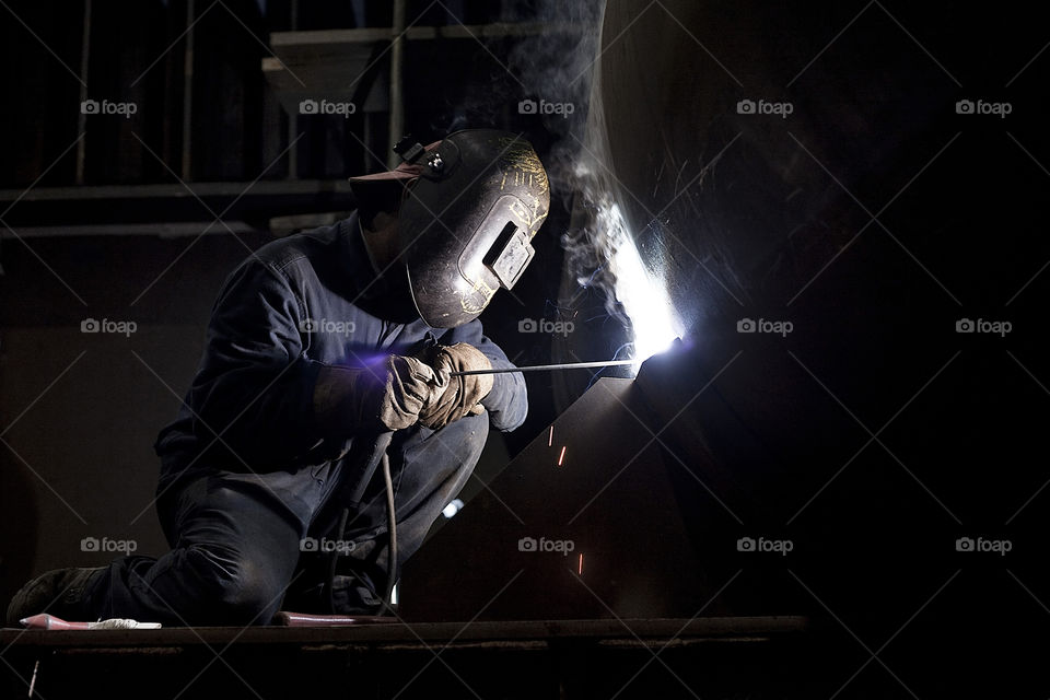 Welder worker closeup un mask