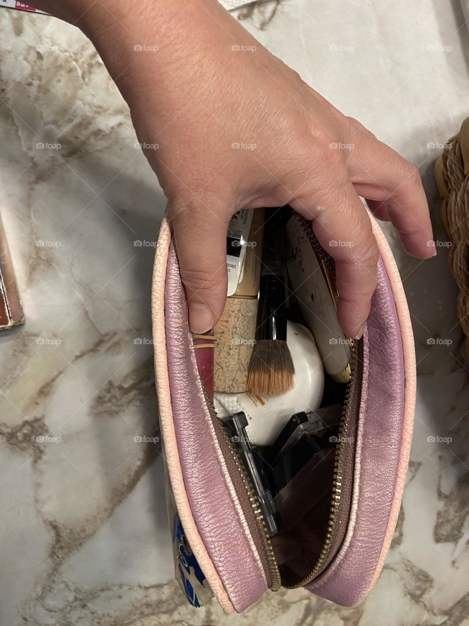 Reaching into my Beauty and the Beast-themed cosmetic bag from Box Lunch to grab an item from my assortment of brushes, foundations, eye shadows, and mascaras. Guaranteed what I’m looking for will be in the bottom-I’ll be organized in my next life.