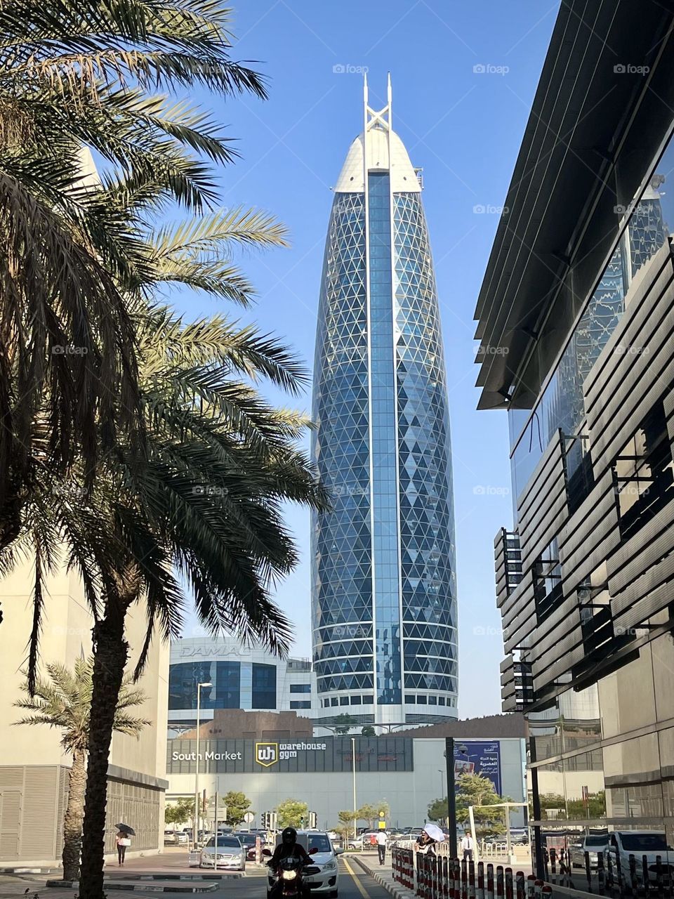 View of a dubai street with a modern glass building