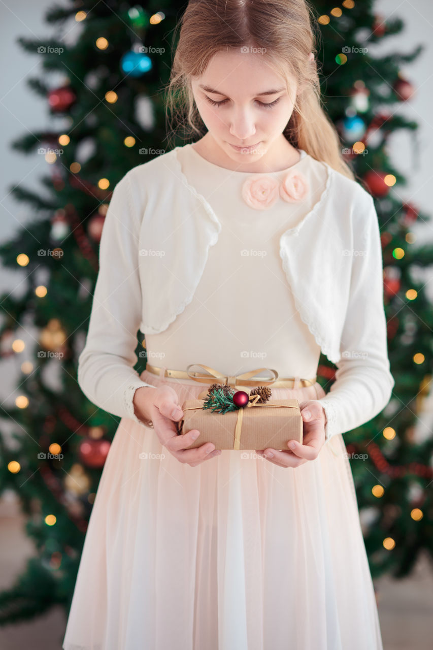 Teenage girl holding Christmas