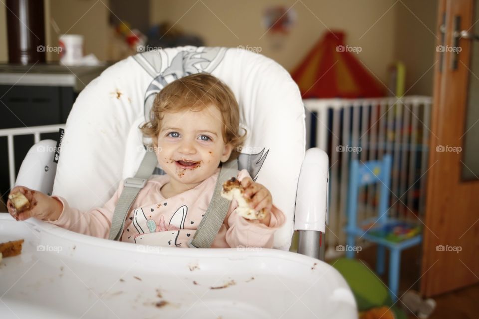 Baby boy sitting in highchair