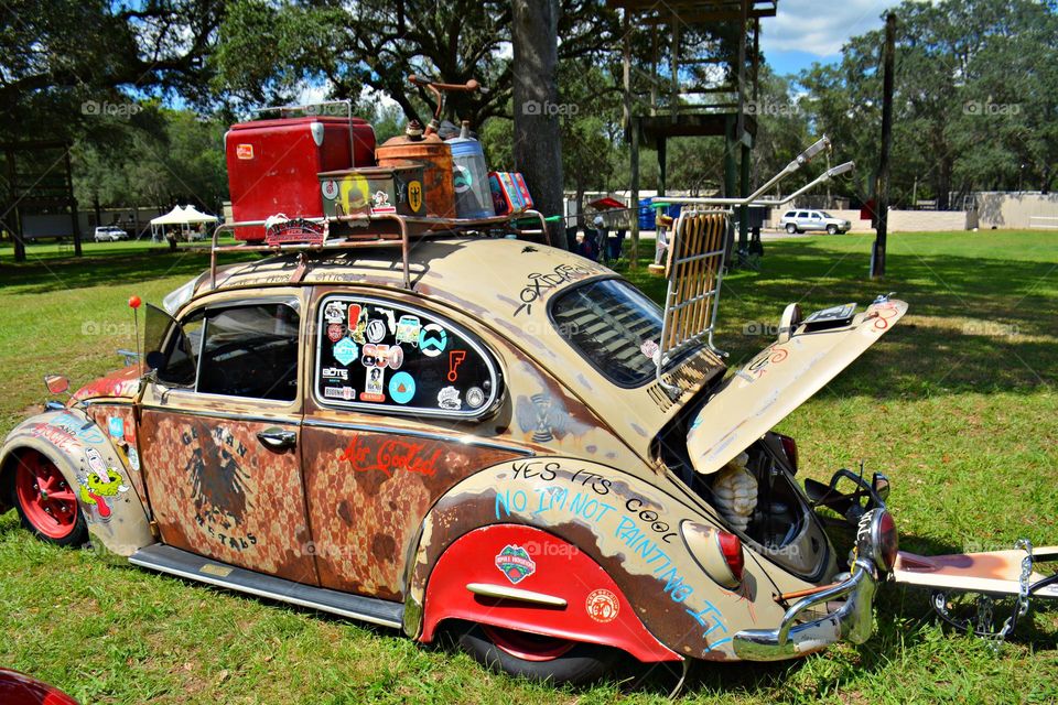 Vintage Vibes: Volkswagen Beetle, also known as the "People's Car", was a compact, economical car with a curved exterior and rear-wheel drive. 