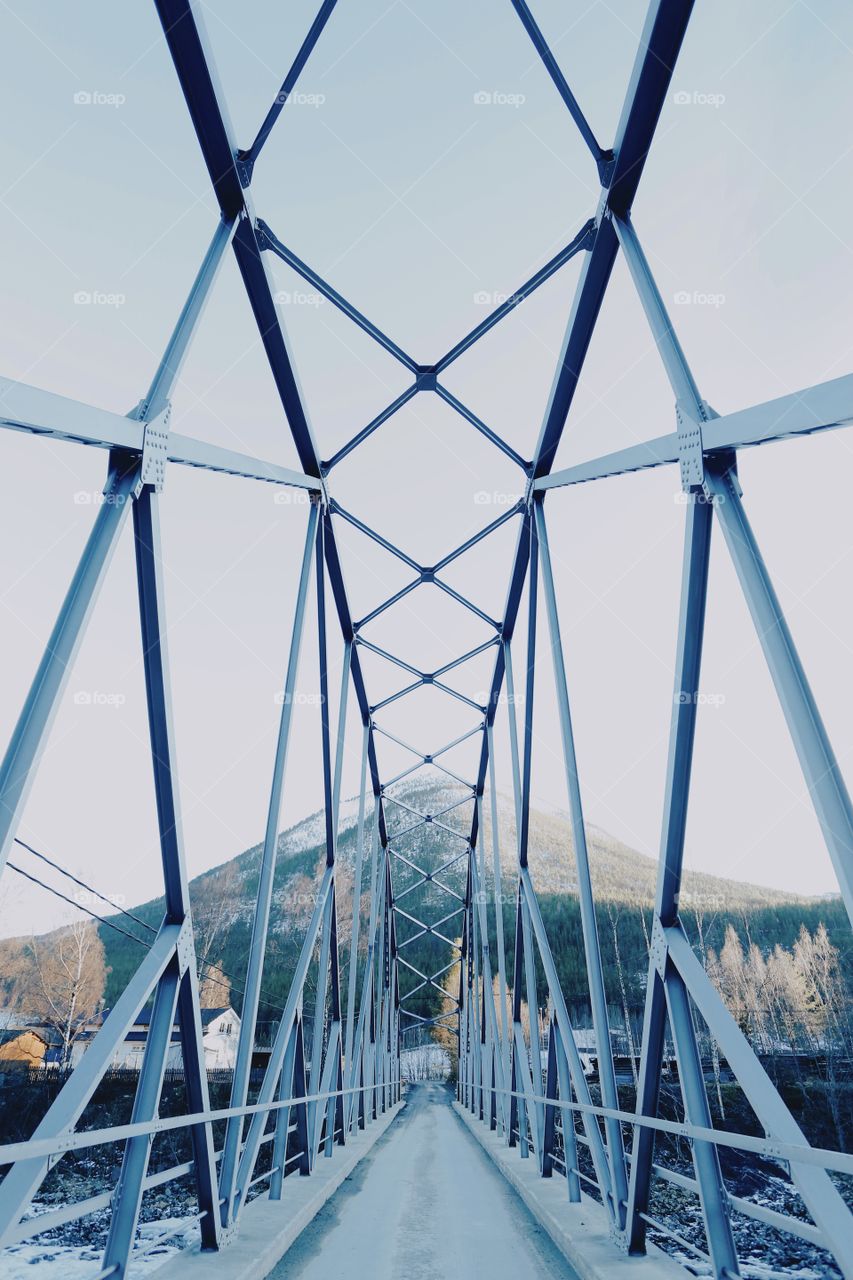 Beautiful metal geometric bridge in mountains 