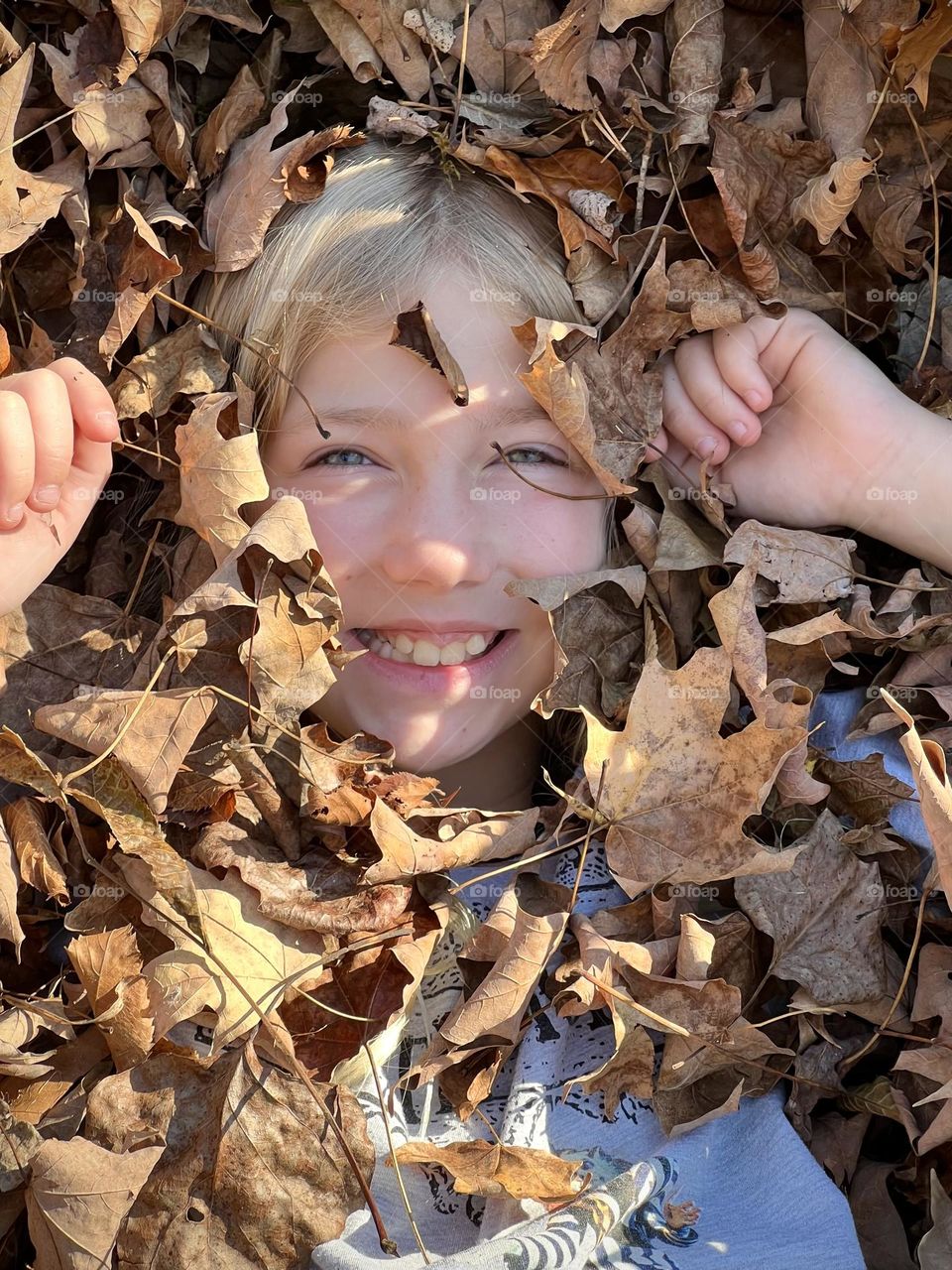 Fun jumping in a leaf pile