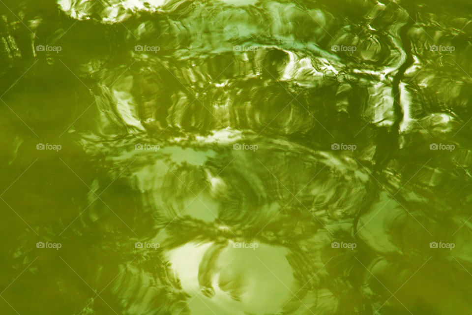 green water with light reflections