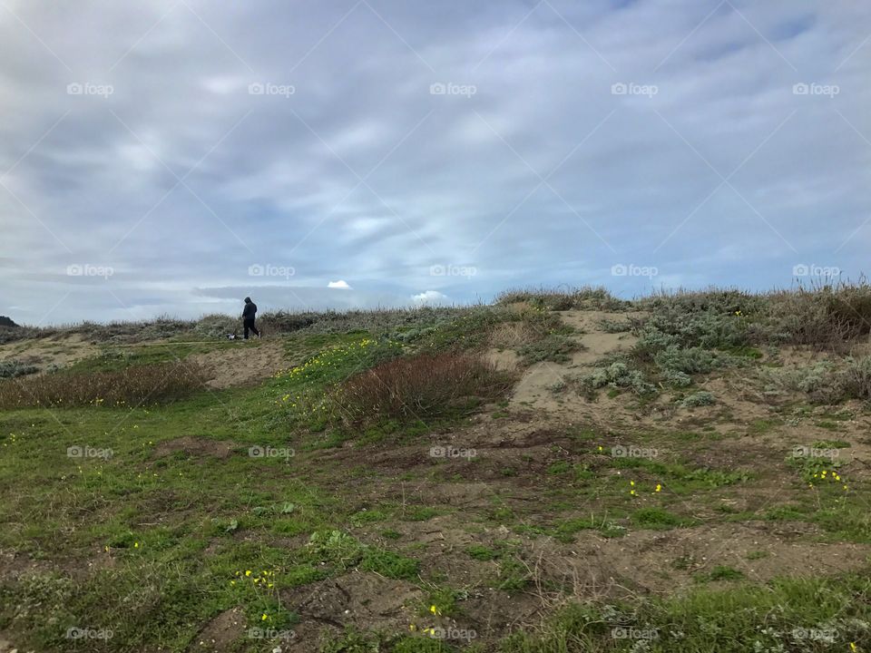 Walking along a coastal trail, near Half Moon Bay, California