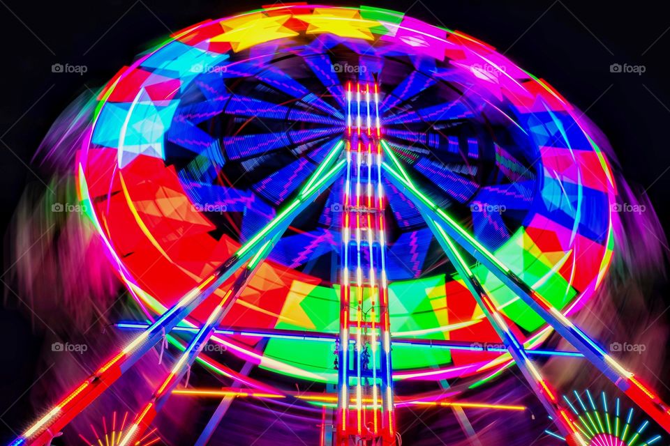 Colorful night ... Colorful life , Local Ferris wheel for kids at Thai temple fair festival 