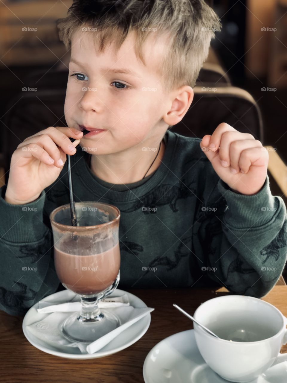 Cute boy drink cacao 