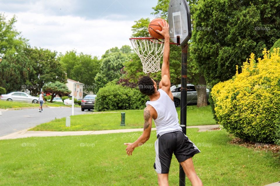 Young man playing basketball 