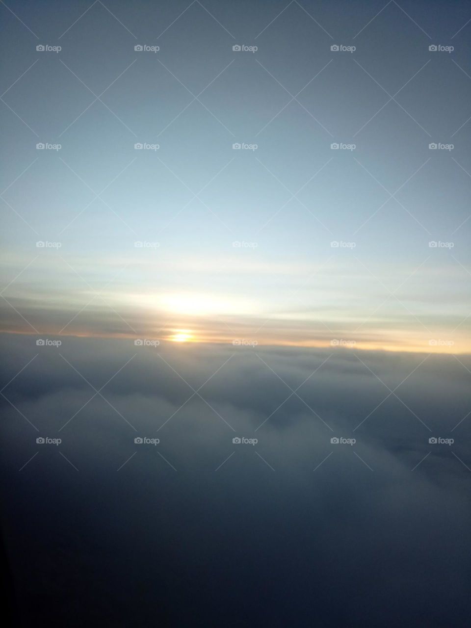 Sun going down in the clouds