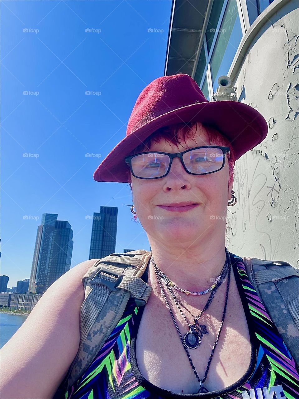 On one of the last really warm days of Indian summer here I am, “Petra Schiller” a.k.a. “Maxine Firefox” standing way up high on the “Pulaski Bridge” at “Newtown Creek” that connects “Greenpoint”, Bklyn to LIC, Queens. 2024. Hypnotic Productions