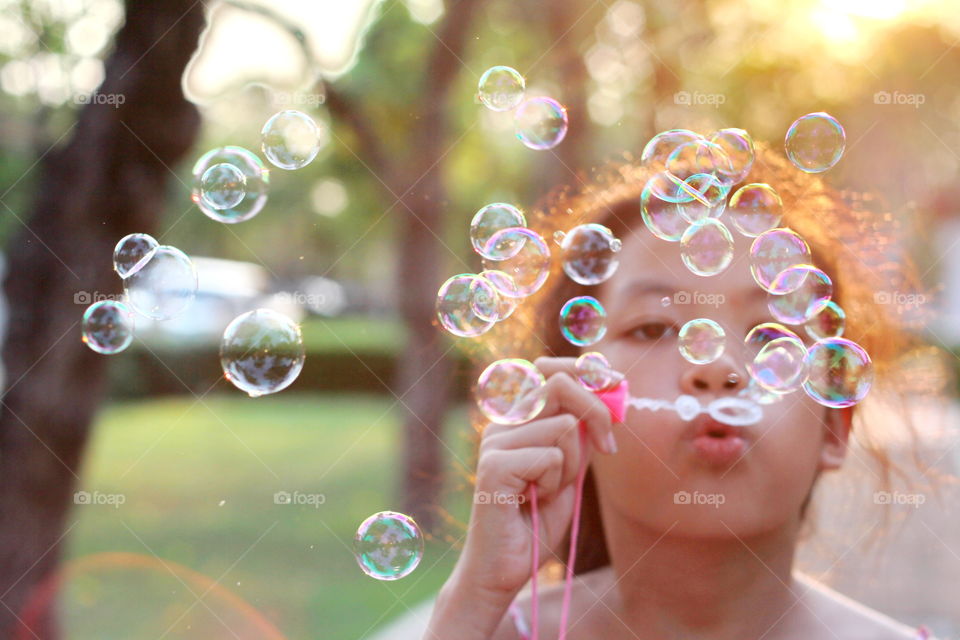 Girl playing bubble 