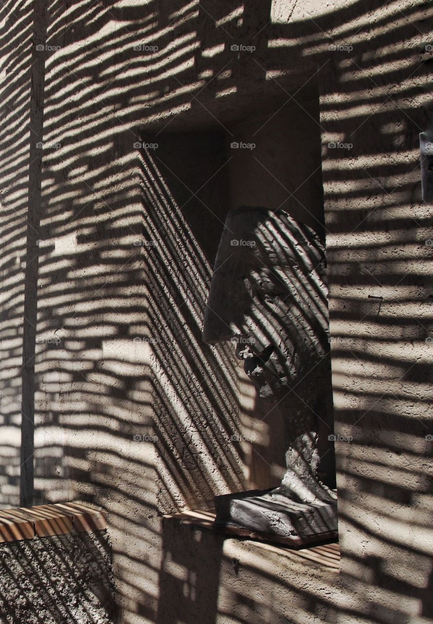 Striped shadows on the wall