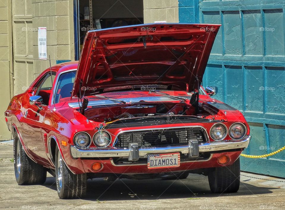 American muscle car with open hood