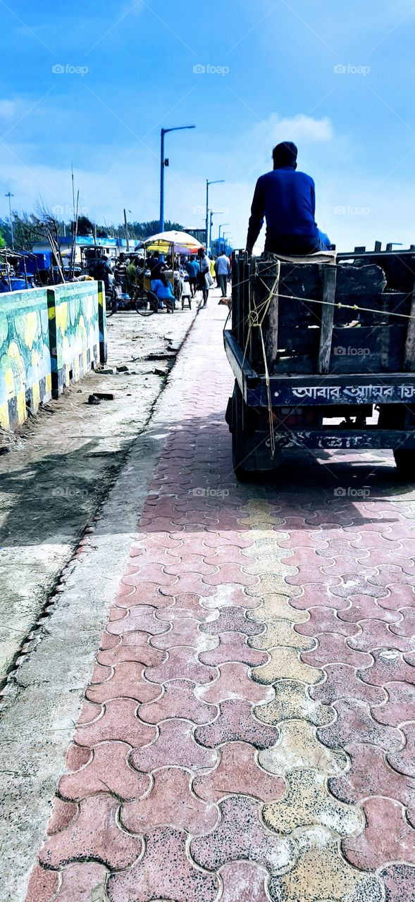 A touch of Rural Bengal. Three wheeler motorised rickshaw used to carry passengers as well as goods from one place to another. One of the cheapest mode of transport.