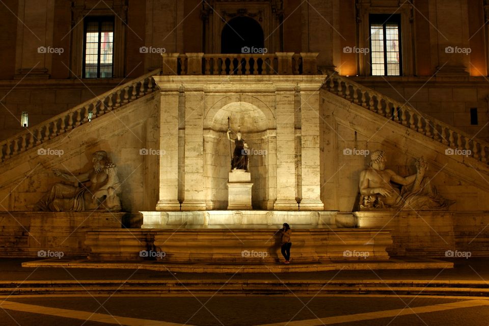 Tourist near a fountain in Rome