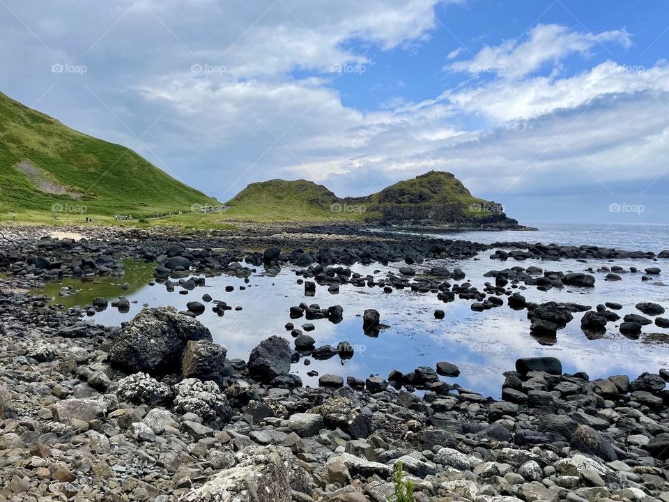 Reflection of blue sky at the Stookans at the Giant’s Causeway.