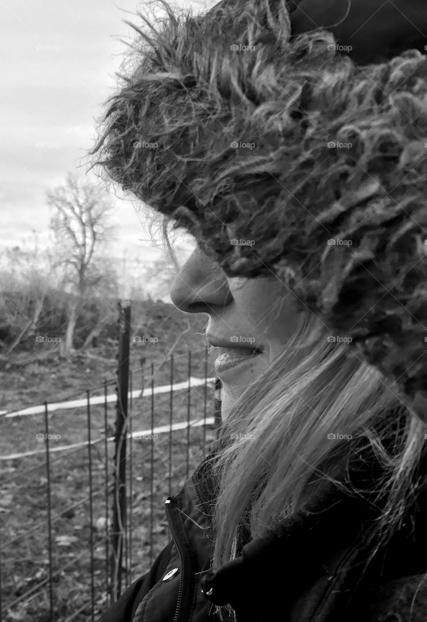 Winter stories, winter, stories, caring, fence, woman, cold, hair, blond, windy, windy, rust, frozen, brown, grass, eyes, ears, mammal, human, beautiful, profile, side view, day, daylight, overcast, gray, black and white, coat, hood