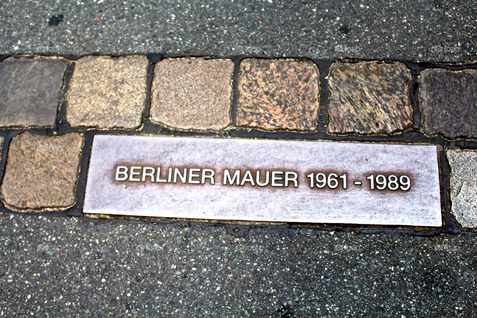 Berlin Wall Reminder. I was crossing a random street in Berlin and I looked down and realized that here once stood the Berlin Wall.