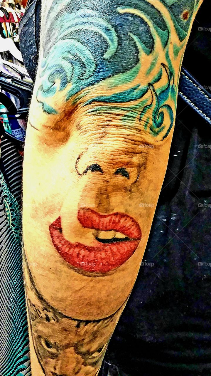 colorful tattoo on back of arm and elbow  unusual