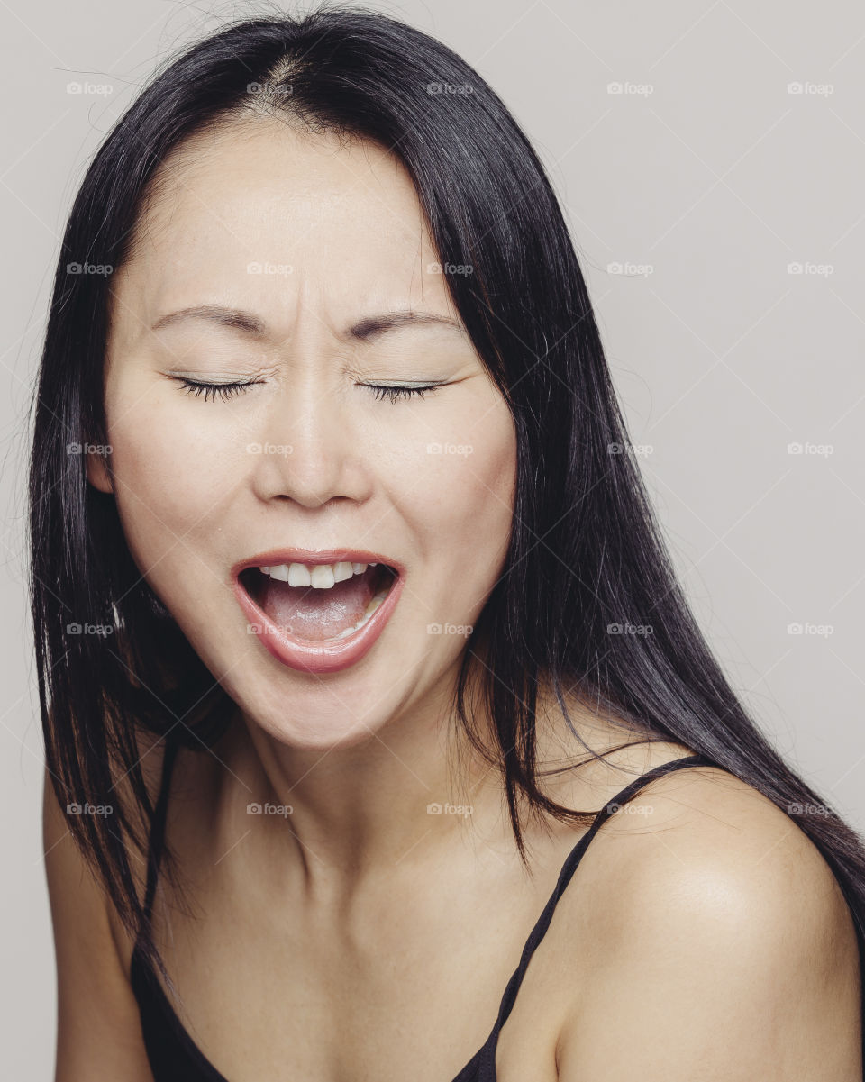 Asian woman of Japanese decent making a funny face