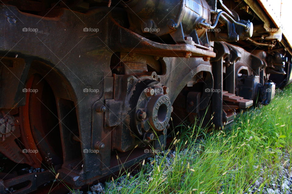 old rusty train wheels and workings