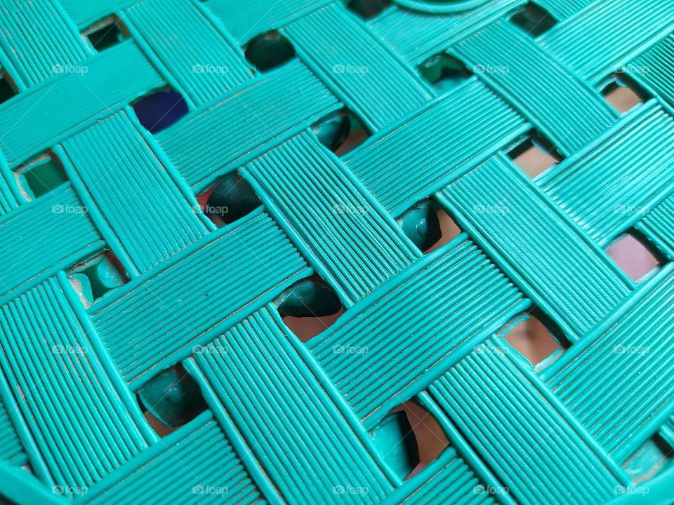 The surface of the chair is a woven rectangle in blue