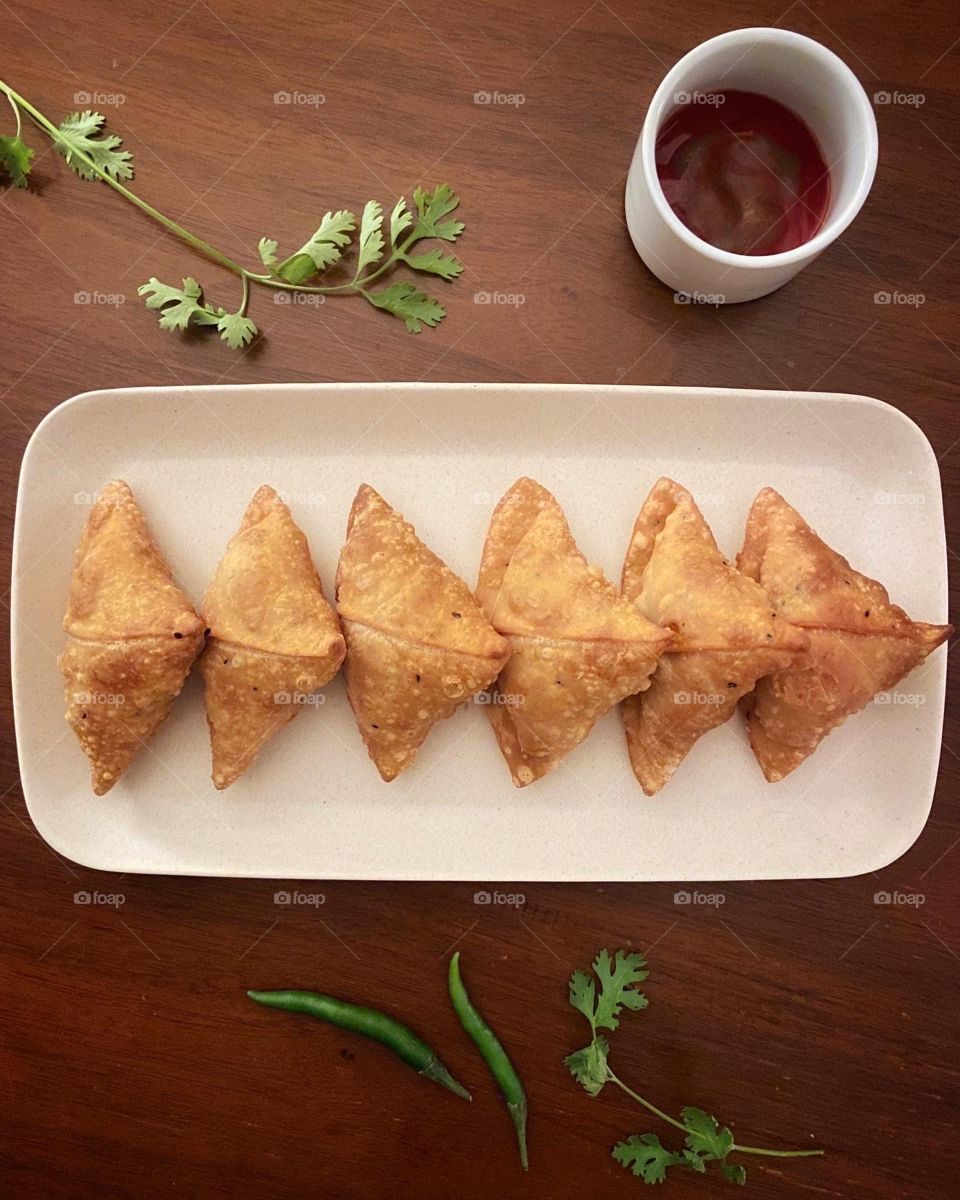 Potato stuffed samosas and chutney 