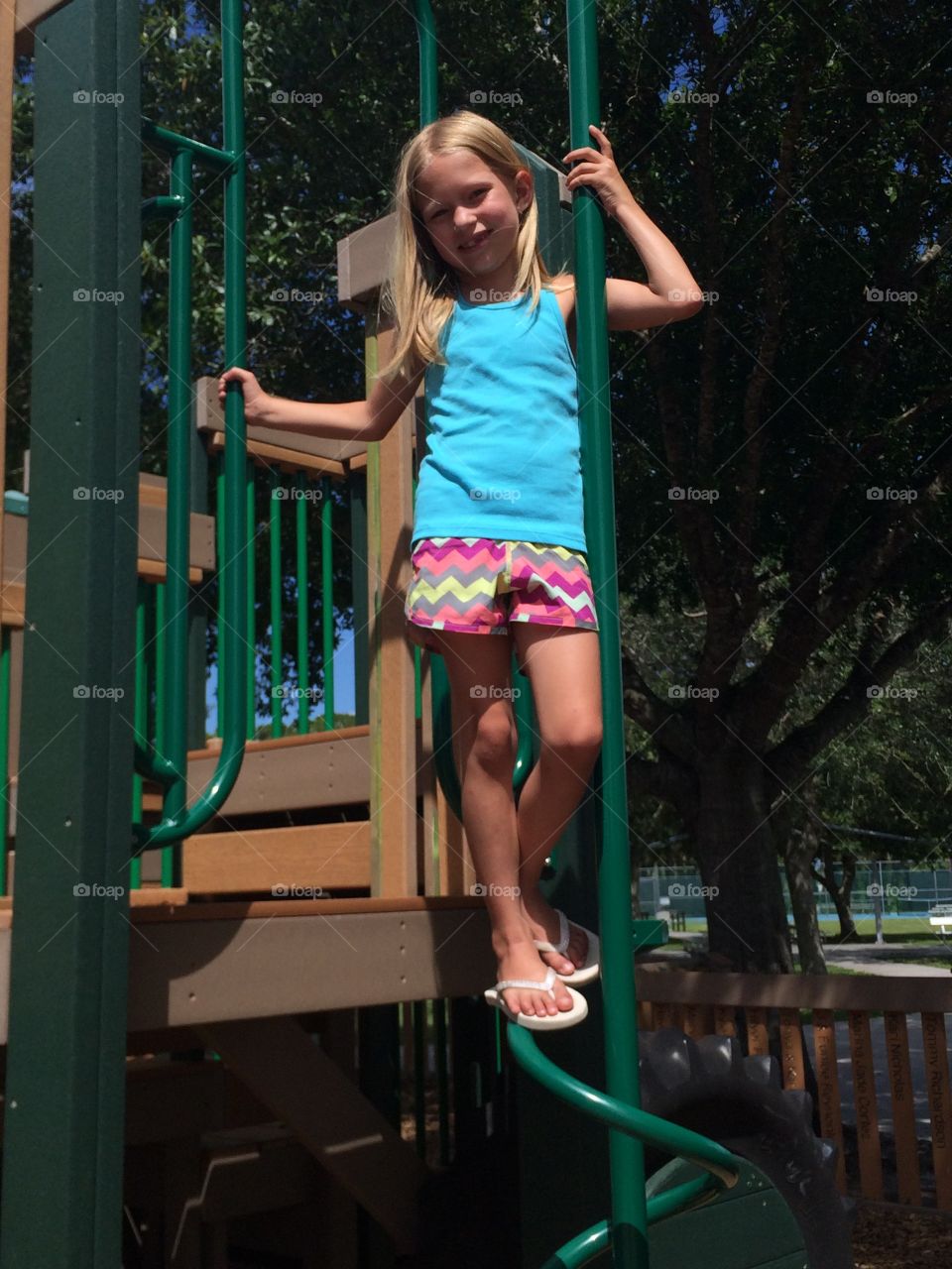 Little girl playing on playground