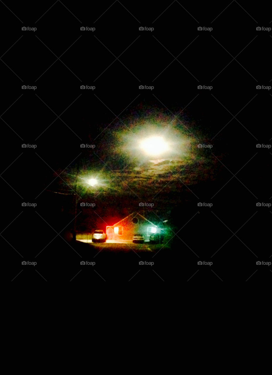 Lights in the night sky over seaside house with red/green marine navigation lights.  Or an alien invasion.  Forget which 