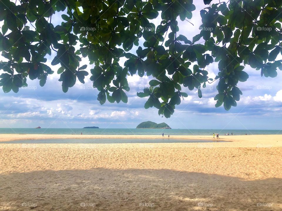 Beach in summer . Mountain and sea.