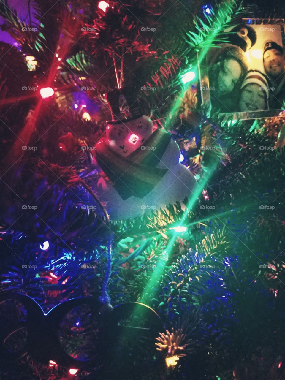 A close up view of our Christmas tree - sporting a unique ornament of two male snowmen embracing one another.