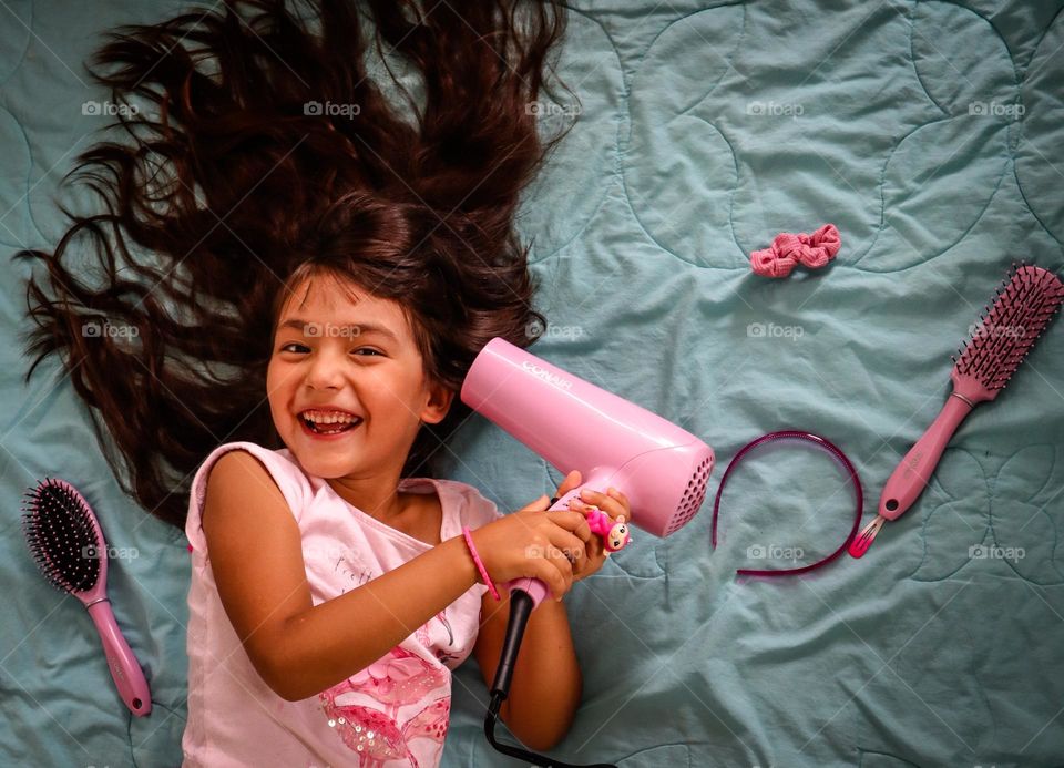 Cute girl with a wonderful healthy long hair