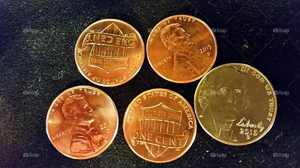 Nine Cents. Shiny new 2015 coins.