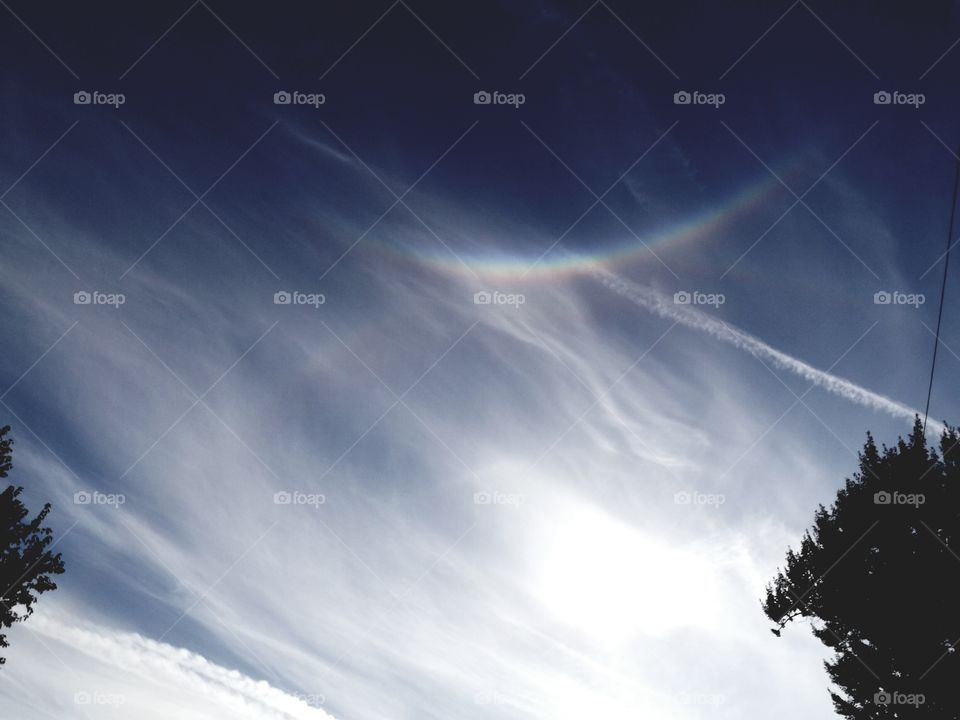 Praying Hands reaching down from Heaven