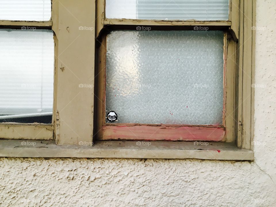 Tiny sticker on a Hollywood window