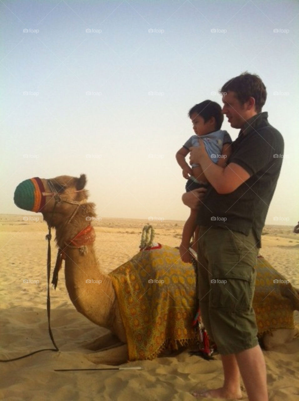 Waiting to ride camel in desert.