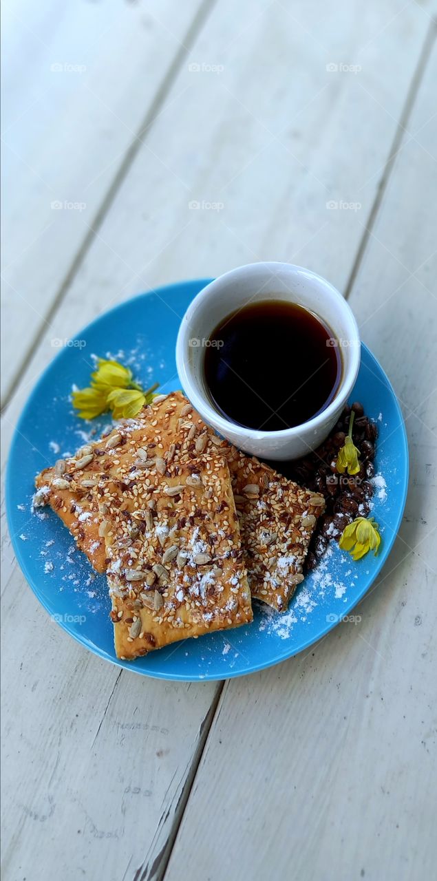 a cup of coffee on the plate